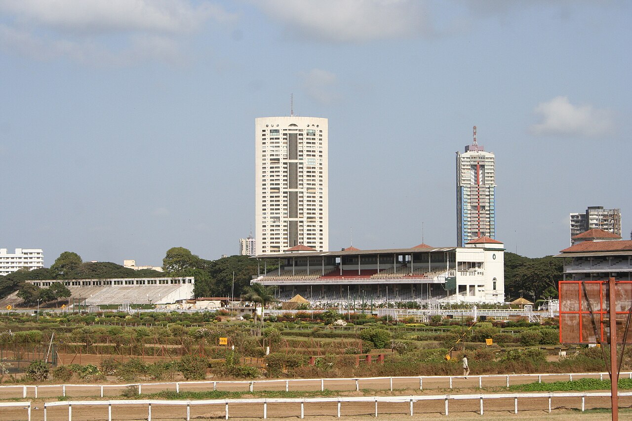 FairPlay Mumbai Horse Racing: horses racing at the Royal Western India Turf Club with the Gateway of India behind