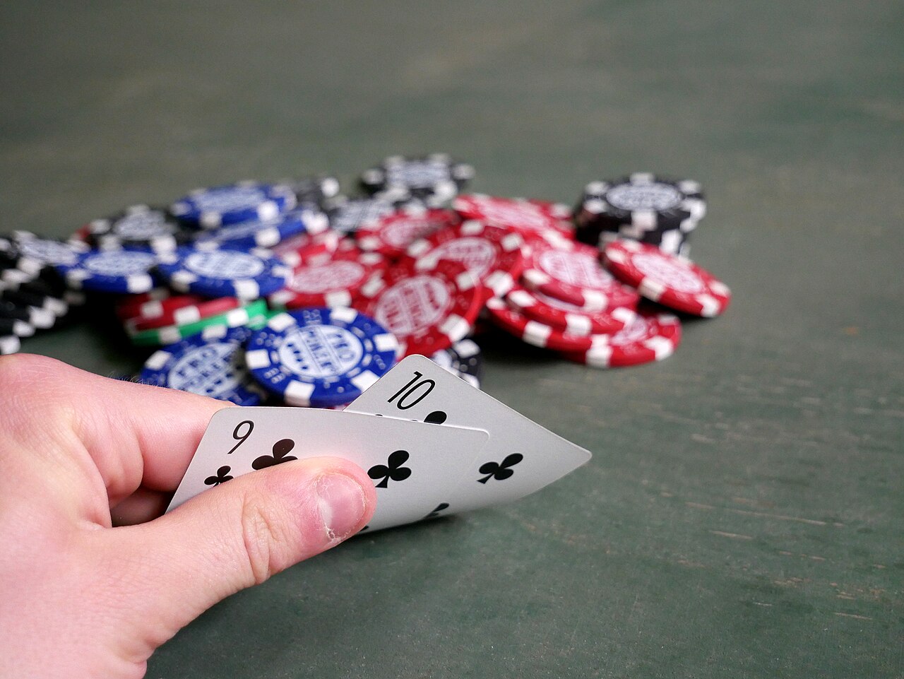 FairPlay Poker Odds: a table of hand probabilities from royal flush to flush beside chips and cards